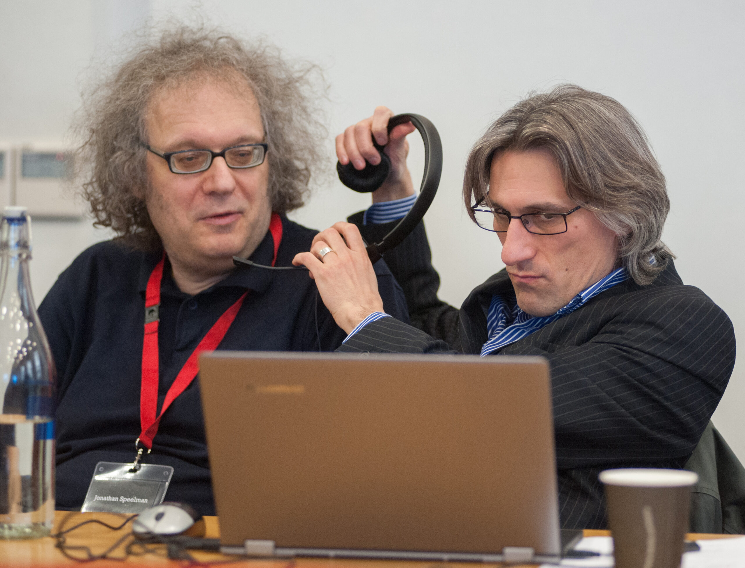 Jonathan Speelman and Daniel King share headphones at the 2013 FIDE Candidates event in London, courtesy of John Upham Photography