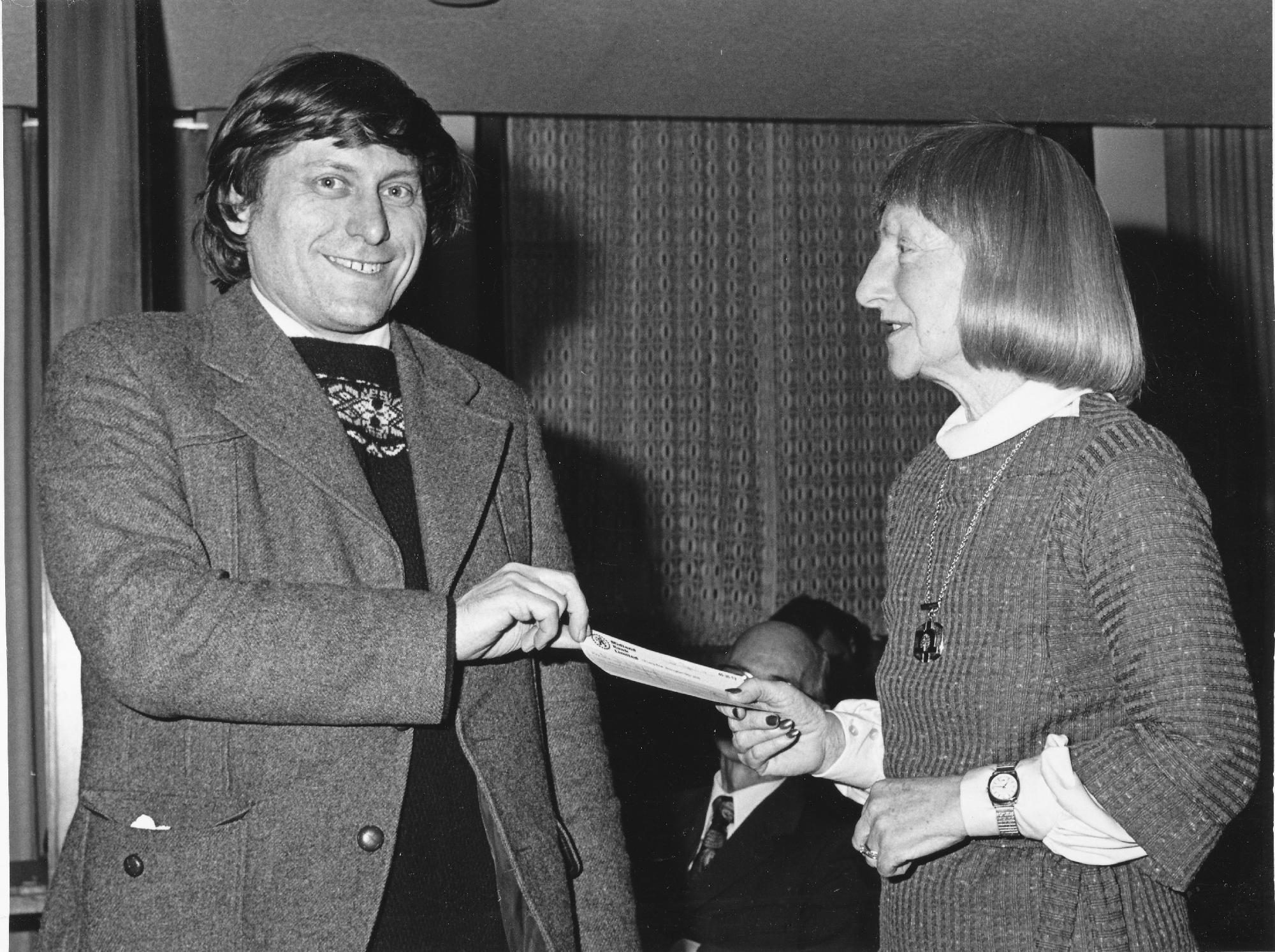 Dave Rumens is pleased to accept a cheque for £200 from Lady Thelma Milner-Barry for winning the 1978 Nottingham Congress with 5.5/6. Photograph provided by Nottinghamshire County Council.