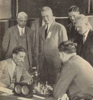 Worcester, circa 1931: Mir Sultan Khan (left) plays Theodore Tylor, while Sir George Thomas (far left) and Arthur Mackenzie (far right) spectate. Photo courtesy of Britbase.