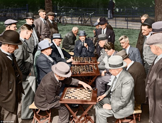 CHECK MATES: Elderly members of the Clapham Common Open Air Chess and Draughts Club, circa 1920. The club met regularly during the afternoons to play on Clapham Common in south London. Copyright : Keystone
