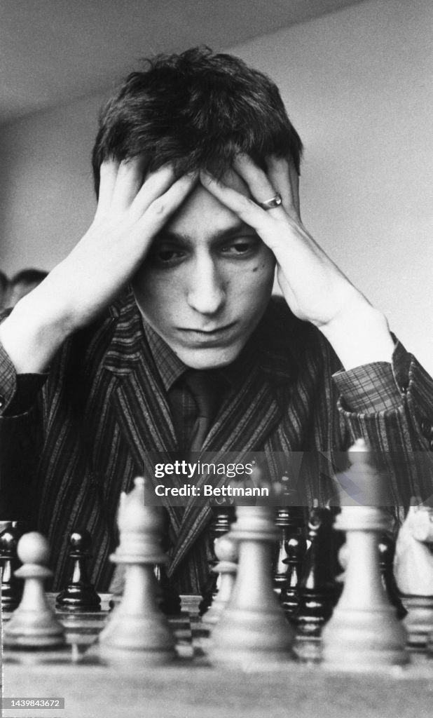 Getty Images: Before making a move, Michael Basman, 21, rests his head in his hands. Michael was the highest placed of the British entrants. (Photo by Bettmann Archive/Getty Images)