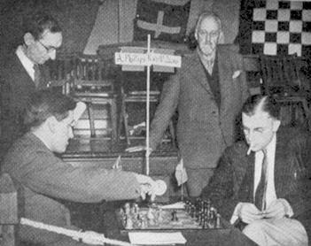 Photograph taken in Hastings on 28 December 1950. Lord Dunsany (standing on the right) is watching the first-round game between Alan Phillips and Weaver Adams, source : http://boylston-chess-club.blogspot.com/