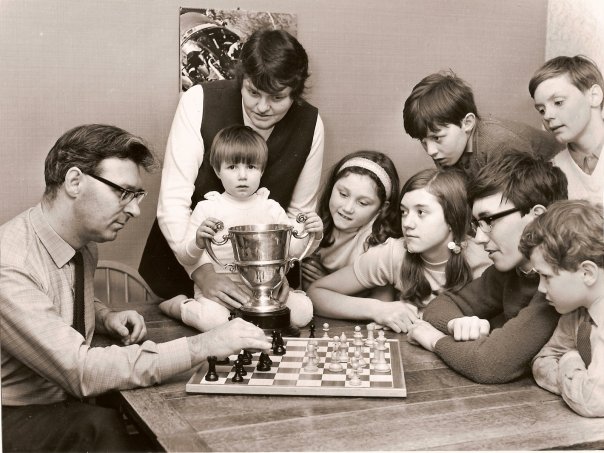 Paul and family receive a chess lesson from John following John's win in the 1972 Southport Open