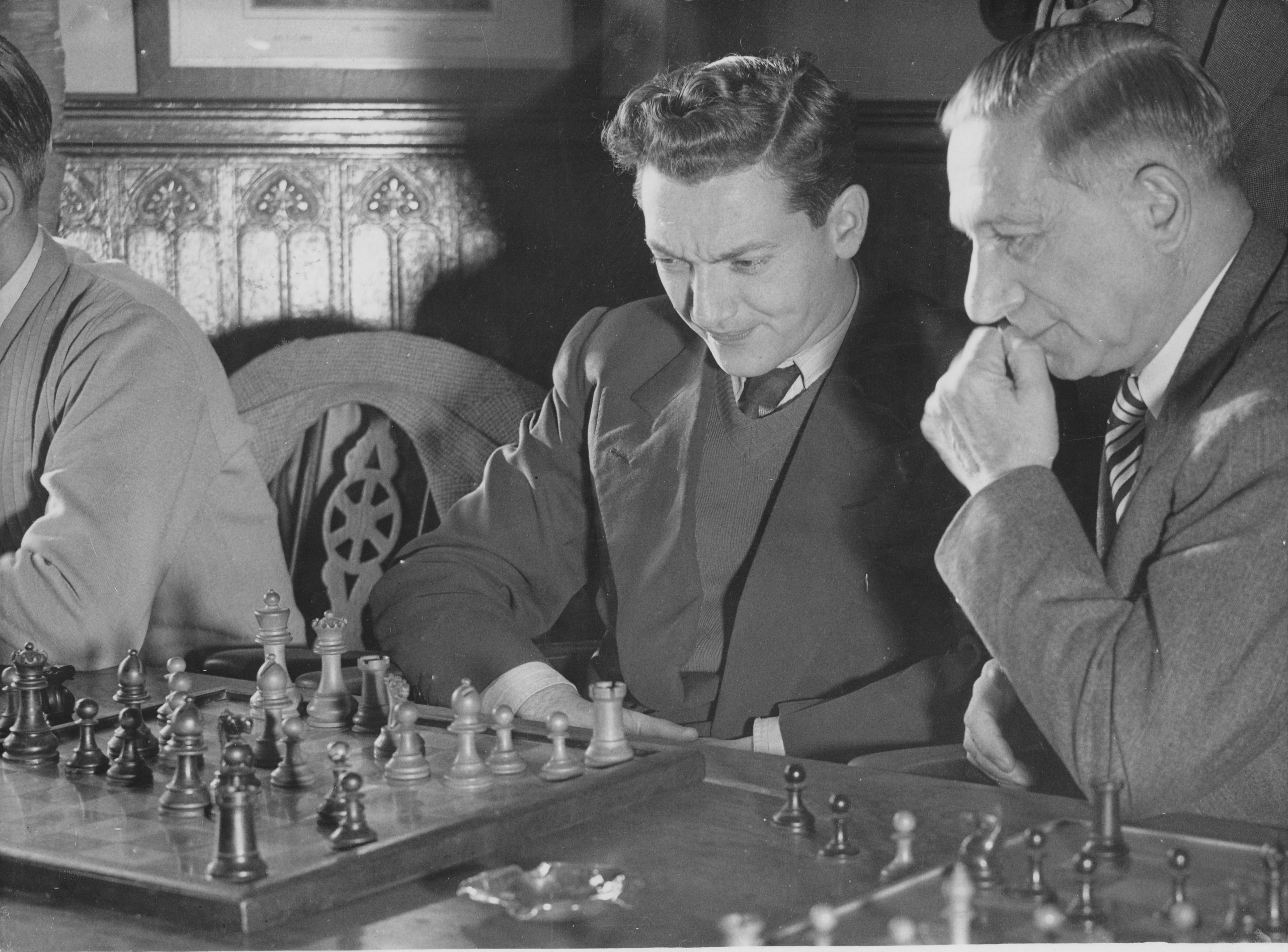 Yanofsky with Edward Lasker at the 1952/3 Hastings Congress, They are studying a (then) new line of the Marshall Ruy Lopez pioneered by Oxford don Sir Theodore Tylor.